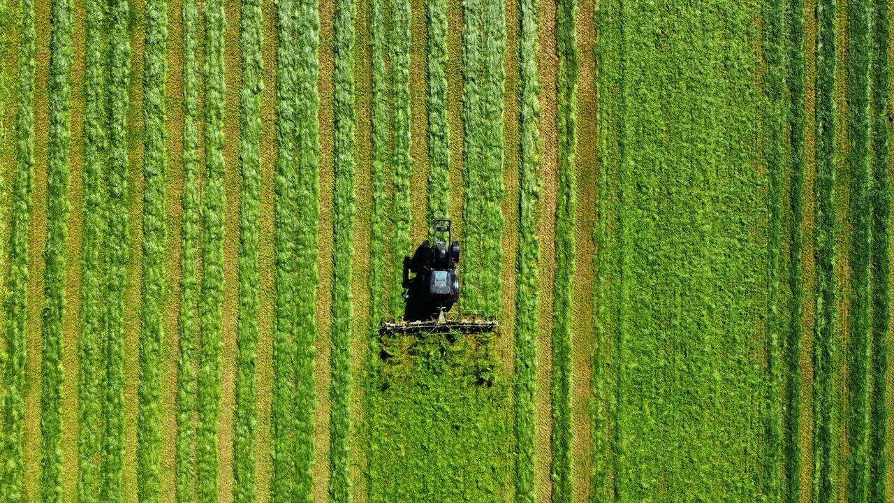 Tractor on farmland from above